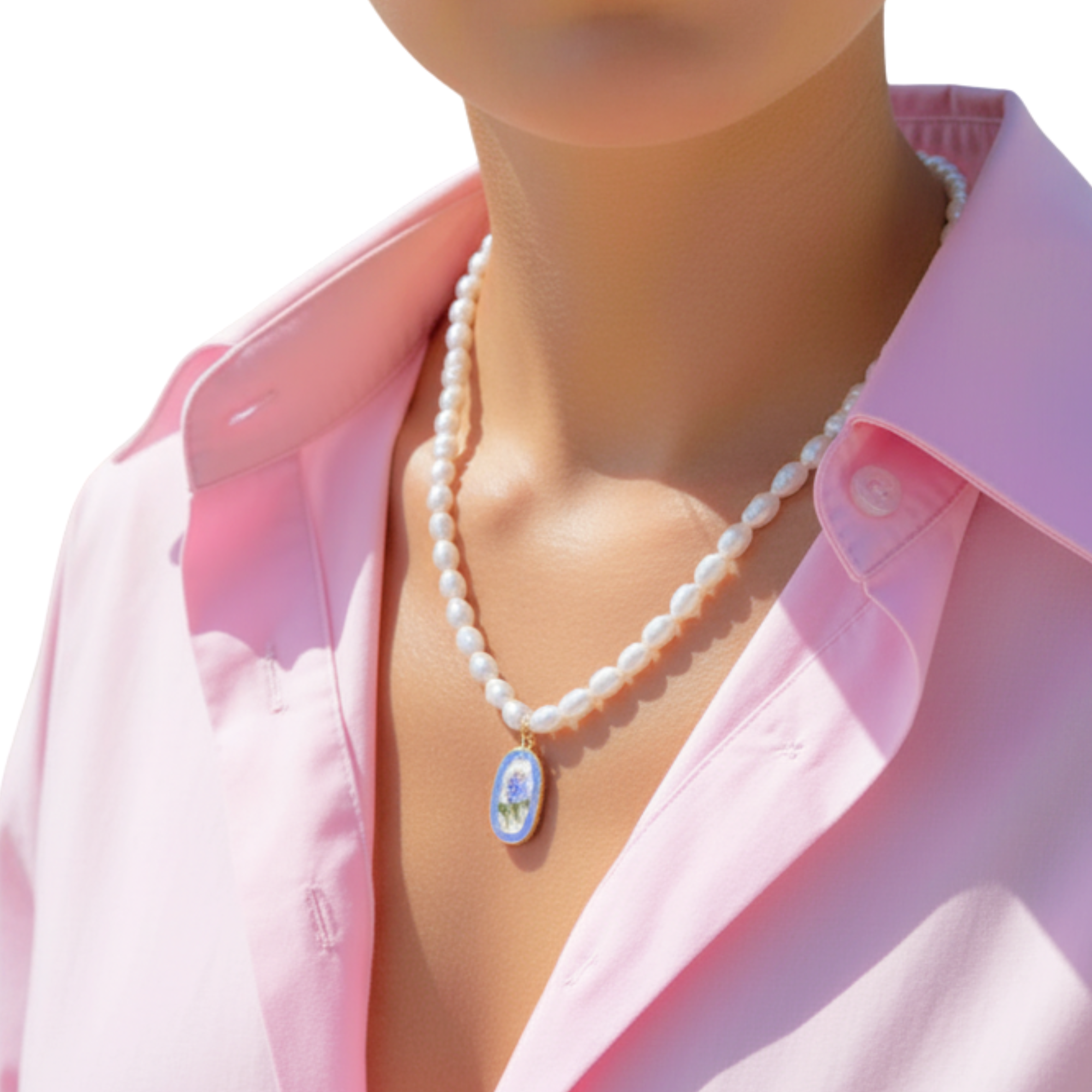 Pearl necklace with a decorative Hydrangea pendant on a person wearing a pink shirt.