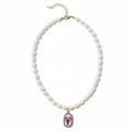 Pearl necklace with a decorative loster pendant on a white background
