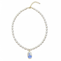 Pearl necklace with a Sailboat pendant charm on a white background