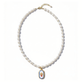 Pearl necklace with a decorative golden retriever pendant on a white background